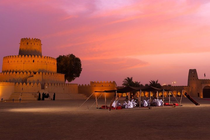 Experience the charm of Al Ain with its stunning landscapes and rich history savoring moments under the soft glow of sunset near ancient fortresses and tranquil sands.